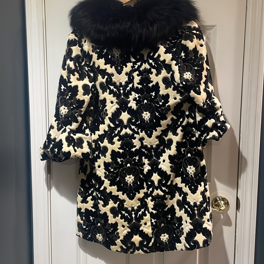Black and tan ornate design. With black faux trim around the collar